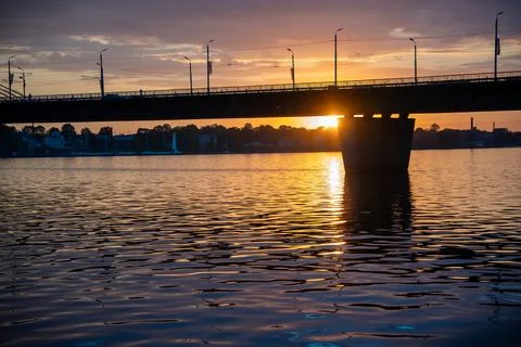 Sunset over the river and a bridge Stock Photos