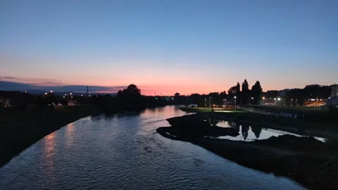 Sunset over the river and city Stock Footage 247735585