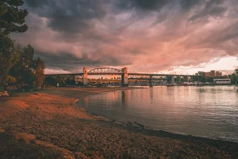 Sunset over the river with a bridge in view Stock Photos