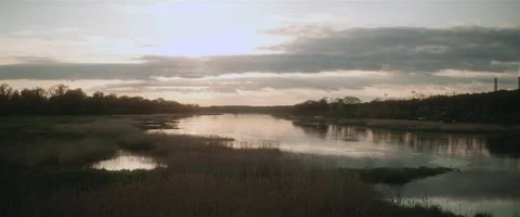 Sunset over the river cinemascope Stock Footage 242862925