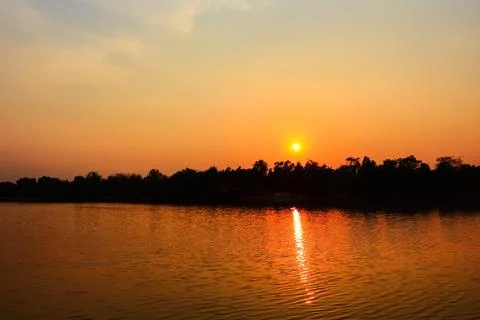 Sunset over the river in the evening, closeup of photo 스톡 사진
