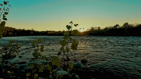 Sunset over the river on a hot summer day Stock Footage 232372253