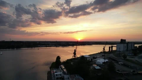 Sunset over the river near a dock. golden hour drone. birds eye Stock Footage 276724334