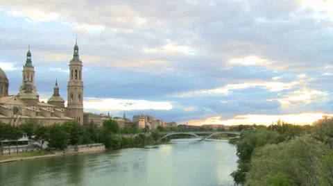From sunset over river to old Basilica monument- pan Stock Footage 38716546