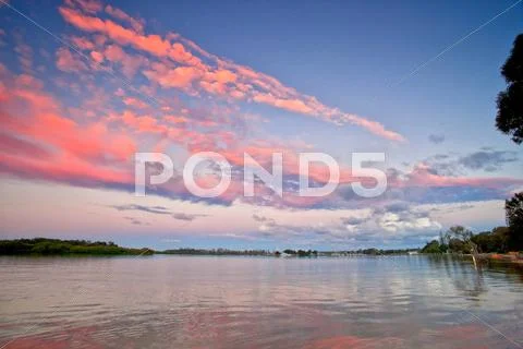 Sunset over the river Stock Photos