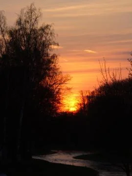 Sunset over river Stock Photos