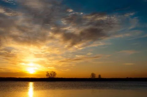 Sunset over the river Stock Photos