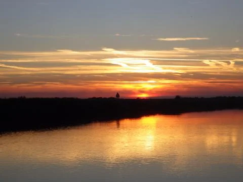 Sunset over river Фото