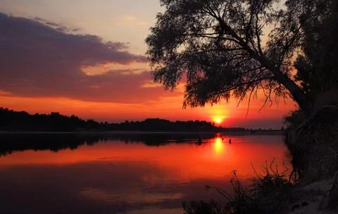 Sunset over the river Stock Photos