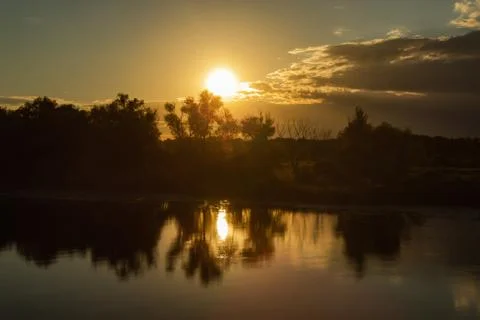 Sunset over the river Stock Photos