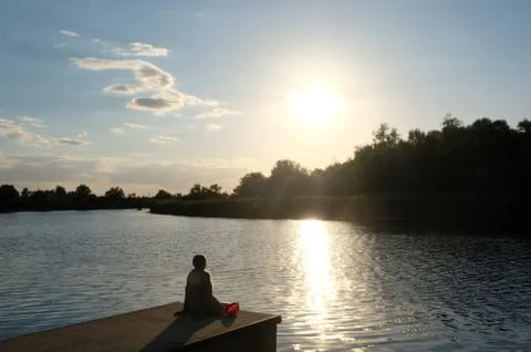 Sunset over the river Stock Photos
