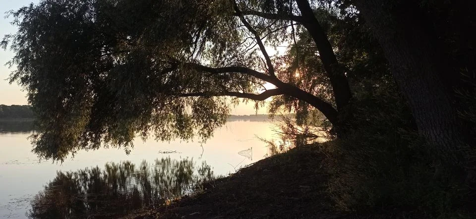 Sunset over the river Stock Photos