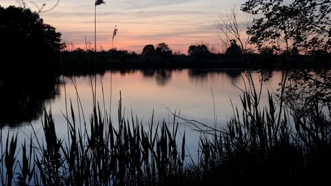 Sunset over the river in the rays of the evening sun. Stock Footage 108435916
