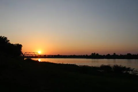 Sunset over the river red and blue sky over the river in the evening with b.. Stock Photos