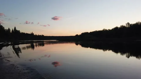 Sunset over the river. Reflection of trees in the water. View from the boat Stock-Footage 136048762