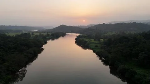 Sunset over river from sky  with sun reflection 3 Stock Photos