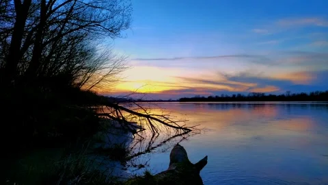 Sunset over a river in springtime Stock Footage 270380918
