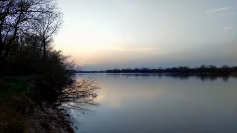 Sunset over a river in springtime. Stock Footage 271579600