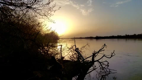 Sunset over a river in springtime. Stock Footage 271581315