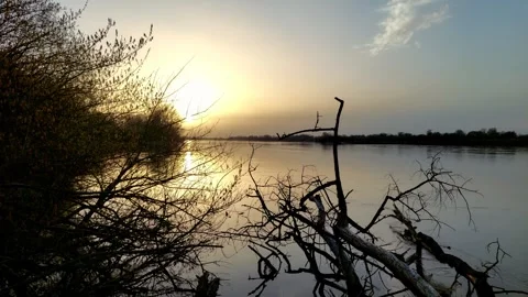 Sunset over a river in springtime	 Stock Footage 273496346