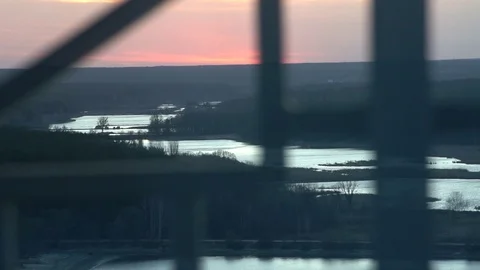 Sunset over the river timelapse. View through the window Stock Footage 121117114