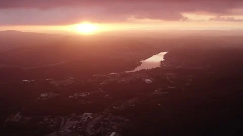 Sunset over river valley in Serra da Boneca near Porto with golden haze and Stock Footage 333466416