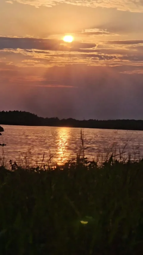 Sunset over the river, the Volga, the sun is setting Stock Footage 312004961
