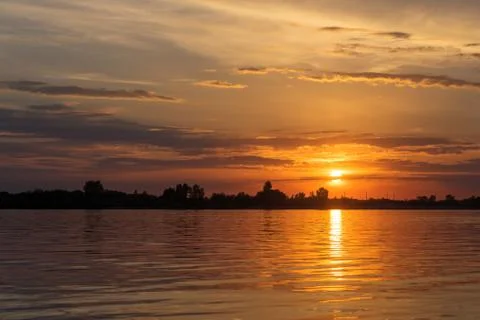 Sunset over river waters Foto stock