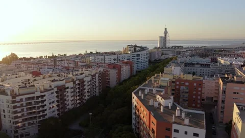 Sunset over riverside city; Parque das Nacoes Video stock 346071654