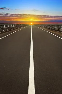 Sunset over the road Stock Photos