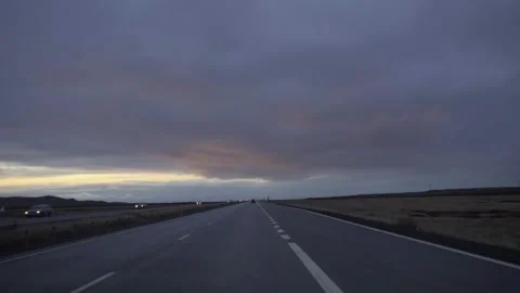 Sunset over the road. Red shades on the clouds Stock Footage 130460131