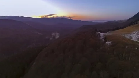 Sunset over road through autumn forest Stock Footage 69903241