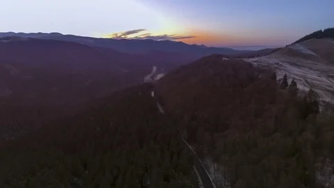 Sunset over road through autumn forest Stock Footage 69903275