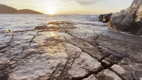 SUNSET OVER ROCKS LOW ANGLE Stock Footage 202172275