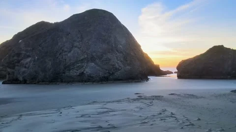 Sunset over rocks on the ocean Stock Footage 141471093