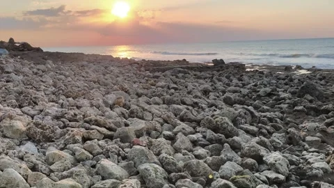 Sunset Over Rocky Beach Coastline - Golden Hour Ocean Waves Video stock 341505181