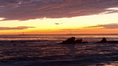 Sunset Over a Rocky Beach Video stock 76694422