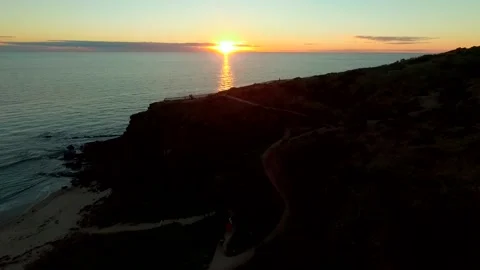 Sunset over rocky beach Stock Footage 262208619