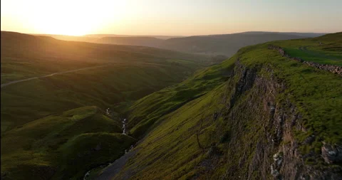 Sunset over rocky cliffs in Swaledale Stock Footage 282933671