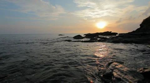 Sunset over rocky coast Stock Footage 2670051
