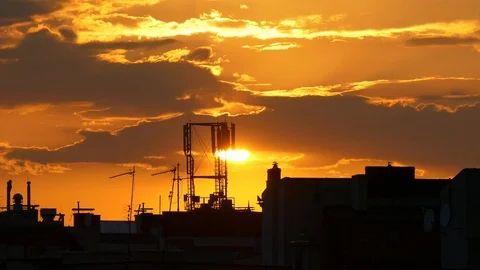 Sunset over the roofs of city Stock Footage 92917743