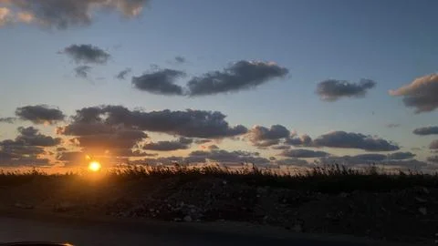 Sunset Over Rural Landscape with Dramatic Clouds Stock Photos