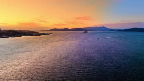 Sunset over San Francisco Bay with Golden Gate in distance Stock Footage 337463358