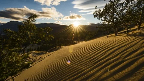 Sunset over sand dunes in mountains of Yukon 8K time lapse Stock Footage 113993624