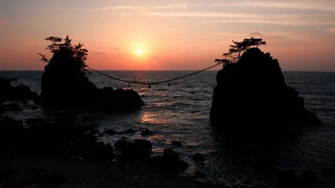 Sunset over Scenic Rocks and a Sea (time lapse) Video stock 108390260