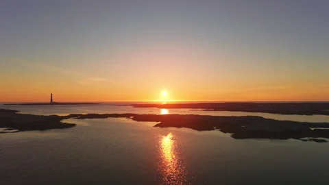 Sunset over sea and lighthouse near Frøya island, Norway Video stock 319536067