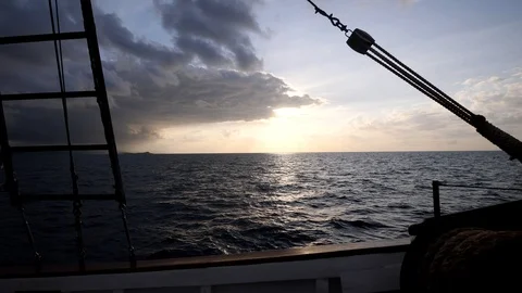 Sunset over the sea with boat side and ladder in foreground Stock Footage 112483515