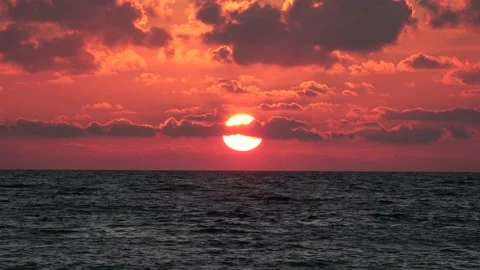 Sunset over the sea with clouds Stock Footage 159297975