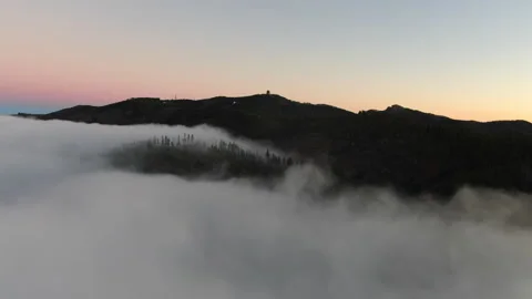 Sunset over a sea of clouds in Gran Canaria. Stock Footage 313290434
