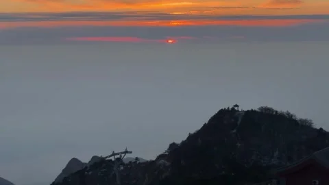 Sunset over Sea of Clouds with Mountain Cable Car and Pavilion Horizontal Vi Stock Footage 326021748